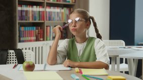Schoolgirl pupil thoughtful student in school write think education class lesson teen child daughter clever kid in eyeglasses studying learning copybook writing test exam answer idea insight knowledge - Powered by Shutterstock - Get 15% off with code: PIKWIZARD15