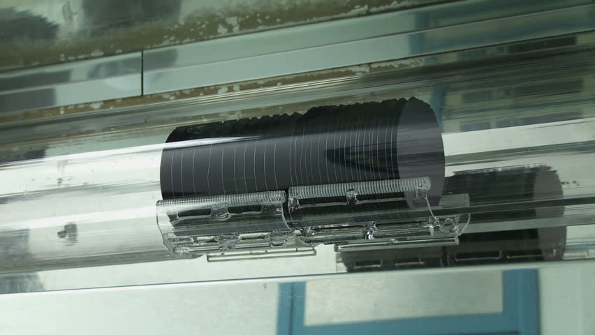 Detail of silicon wafers moving in automated kiln loader during silicon chip