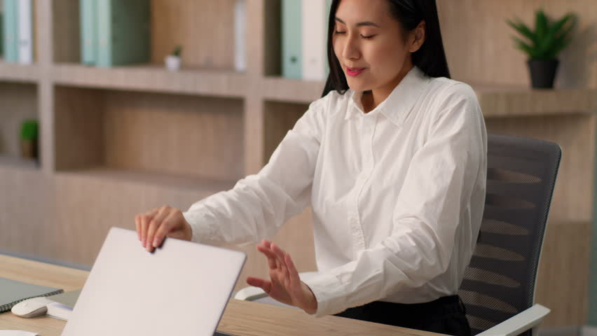 Happy relaxed Asian Chinese woman female office worker girl Japanese Korean businesswoman teacher tutor typing laptop finished online work end closing computer take break relieve stress stretch indoor - Powered by Shutterstock - Get 15% off with code: PIKWIZARD15