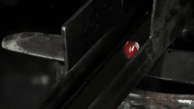 Molten Recycled Glass Globules Falling Through Metal Chute in Toy Marble Production, Close-Up - 4K - Powered by Shutterstock - Get 15% off with code: PIKWIZARD15