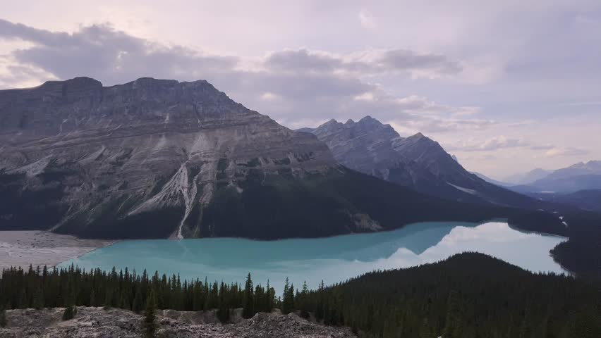 Breathtaking view of Peyto Lake’s turquoise waters nestled among the rugged peaks of the Rocky Mountains in Banff National Park, Alberta, Canada. Zoom out