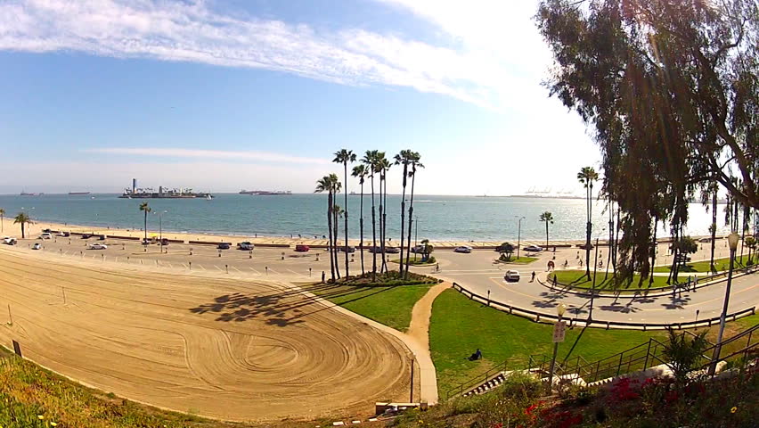 LONG BEACH, CA - APRIL 2, 2013: A wide shot of the beach with palm trees, the