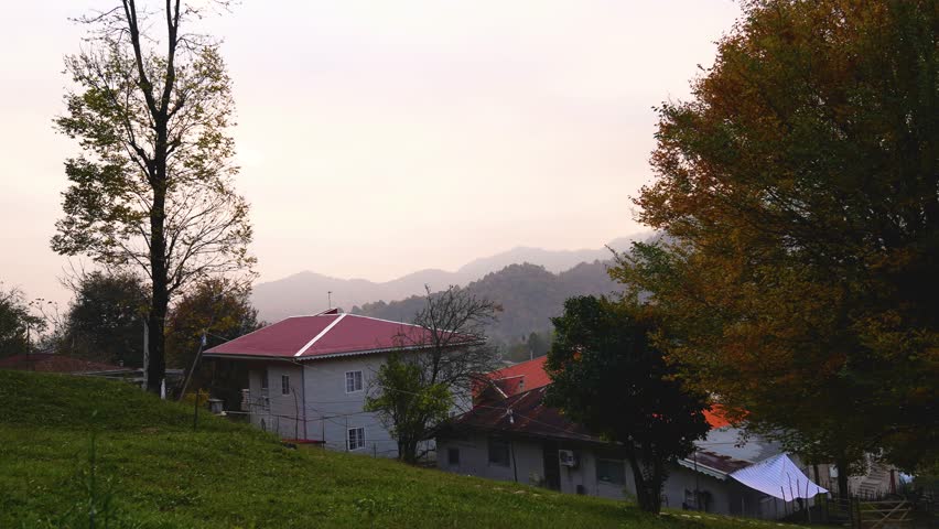 house  village in the autumn woods 