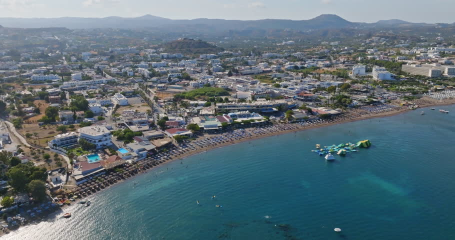 Panoramic drone shot overlooking of the waterfront of the Faliraki town, Rhodes