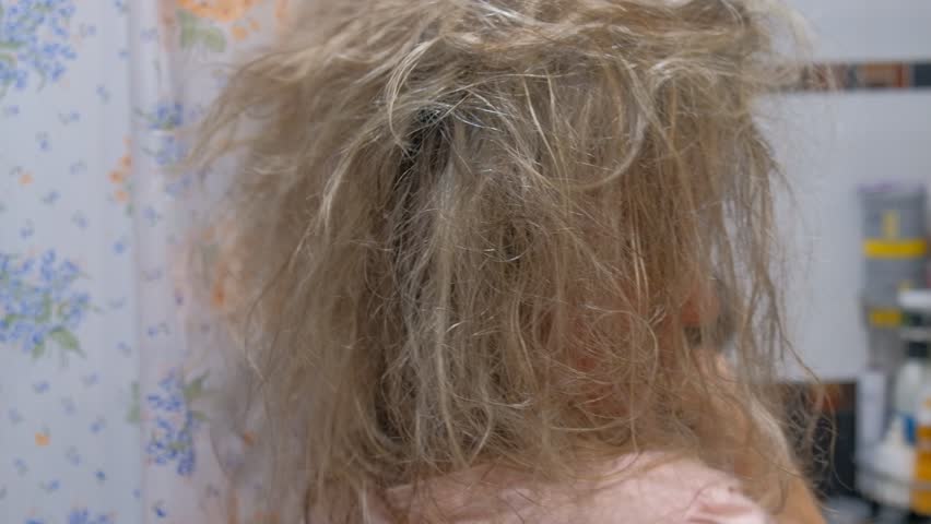 woman girl blonde hair blow dry hair after bathing washing face not visible visible human hair