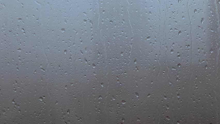 Rain drops on the window on rainy gloomy day