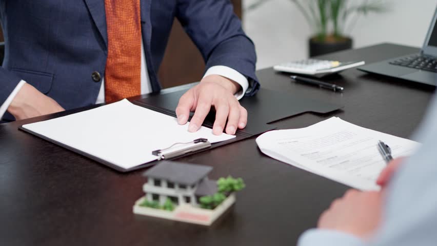Men shaking hands during a real estate deal