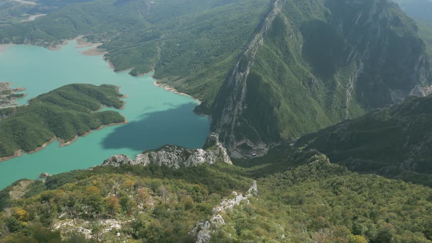 Breathtaking aerial view of Bovilla Lake in Albania with lush green mountains and turquoise water