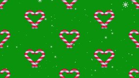 Animation of snow falling over Christmas candy canes on green background. Festivity, celebration and tradition concept animated seamless loop video. - Powered by Shutterstock - Get 15% off with code: PIKWIZARD15