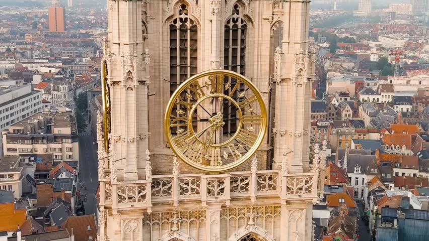 Dolly zoom. Antwerp, Belgium. Spire with the clock of the Cathedral of Our Lady (Antwerp). Historical center of Antwerp. City is located on river Scheldt (Escaut). Summer morning, Aerial Viewa