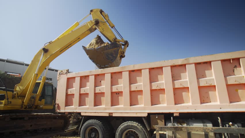 Excavator is digging at construction site