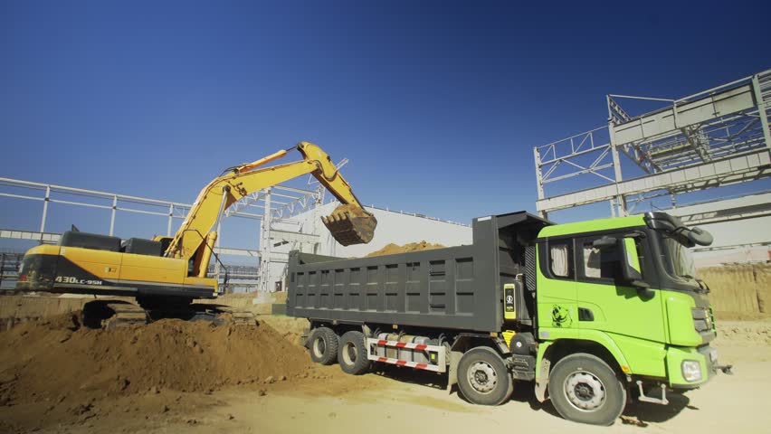 Excavator is digging at construction site
