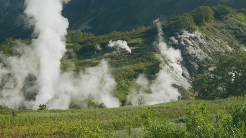 Geothermal Steam Vents in a Lush Valley