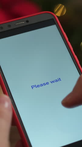 Vertical video. Paying online for Christmas shopping using smartphone and bank credit card.
