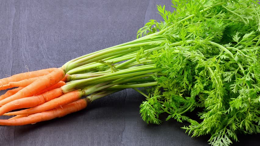 fresh baby carrot on wooden background