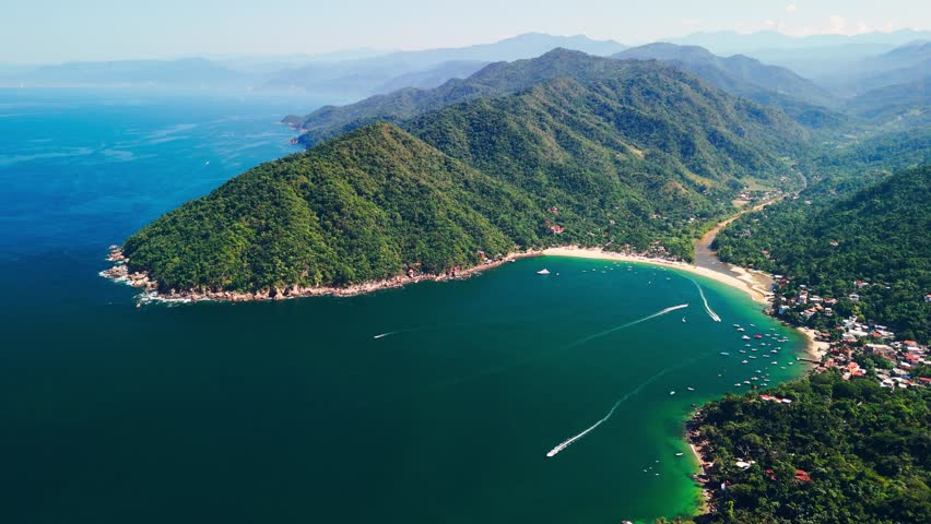 Wide shot of the town of Yelapa, Mexico. Water taxi in and out of the paradise beaches