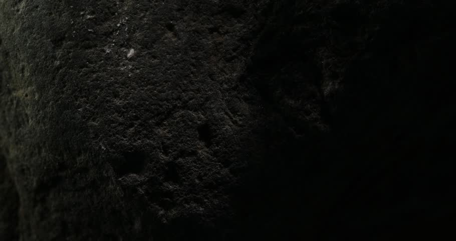 Dark Rocky Surface with Natural Cracks Close-Up