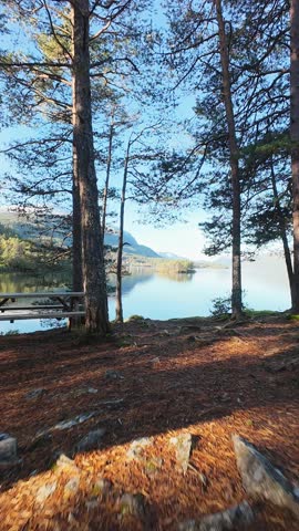 Small island in the center of lake in the mountains of Norway