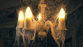 Ghosts Lights Up And Shakes Chandelier, Scary Haunted House - Powered by Shutterstock - Get 15% off with code: PIKWIZARD15