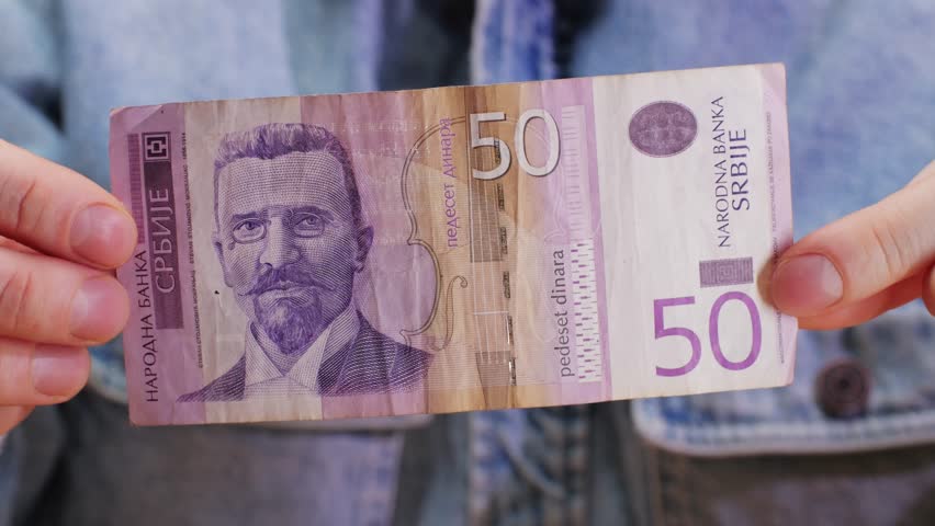 Holding a 50 Peso Bill Exploring Its Economic Value and Cultural Significance and Impact