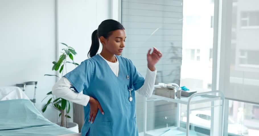 Woman, nurse and headache at hospital with stress for overworked, healthcare burnout and exhausted. Female person, caregiver and migraine or pain at clinic with anxiety, crisis and work overload