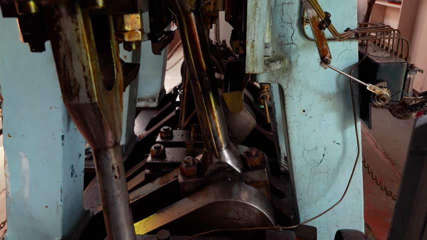 Close view of a 19th-century steamboat engine running