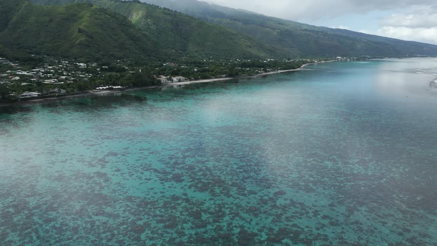 Turquoise Waters Of Plage Vaiava Beach In Tahiti, Puna'auia, French Polynesia. Aerial Drone Shot