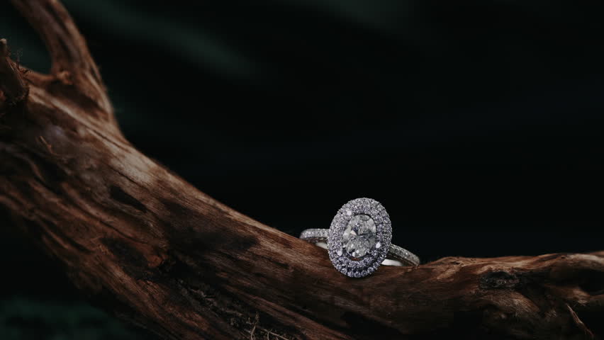 beautiful bright and shine diamond ring on the wood wtih black background