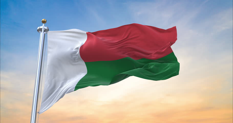 Flag of Madagascar realistic waving in the wind with sundown background (Perfect Loop)