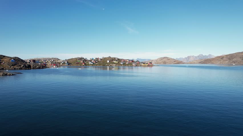 A typical small Inuit village (settlement) in Greenland. Filmed during the summer on a sunny day.