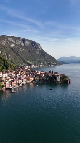 Lakeside Varenna with Clear Sky and Mountains on the shore of Lake Como, Vertical shot