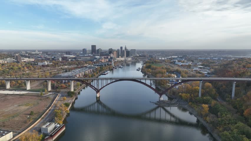 Aerial drone footage of the Mississippi River near St. Paul, Minnesota, featuring the Smith Avenue High Bridge and autumn scenery