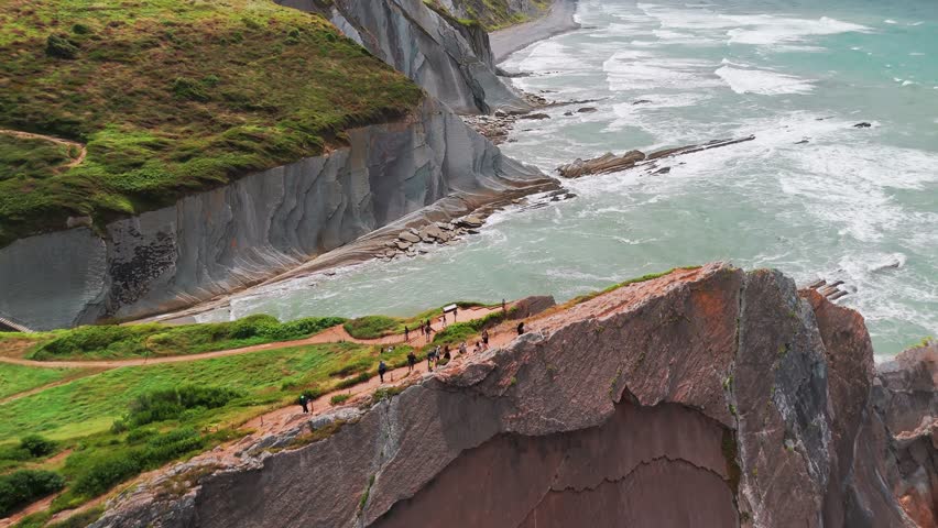 Aerial view of the beautiful rocky coast near Itzurun beach, Zumaia town, Basque country, north of Spain. Itzurun beach is famous for the longest set of continuous rock strata in the world