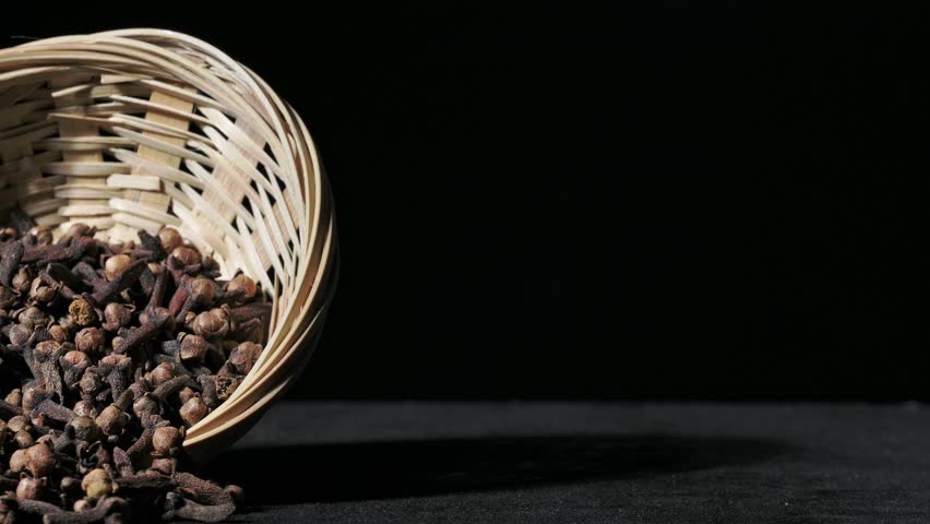 Clove Grains In A Basket. On A Black Ground
