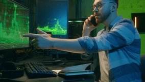 Joyful glad Caucasian male broker crypto trader smile guy worker salesman speaking mobile phone smartphone late night at home man working stock businessman show thumb up computer good result business - Powered by Shutterstock - Get 15% off with code: PIKWIZARD15