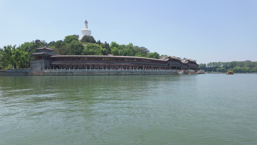 A stunning and breathtaking view of traditional architecture beautifully surrounded by serene water