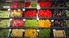 Shelf with Variable Vegetables in a SuperMarket. Ripe Tomatoes Cucumbers Cabbage Peppers Mushrooms Dill Onions etc. - Powered by Shutterstock - Get 15% off with code: PIKWIZARD15