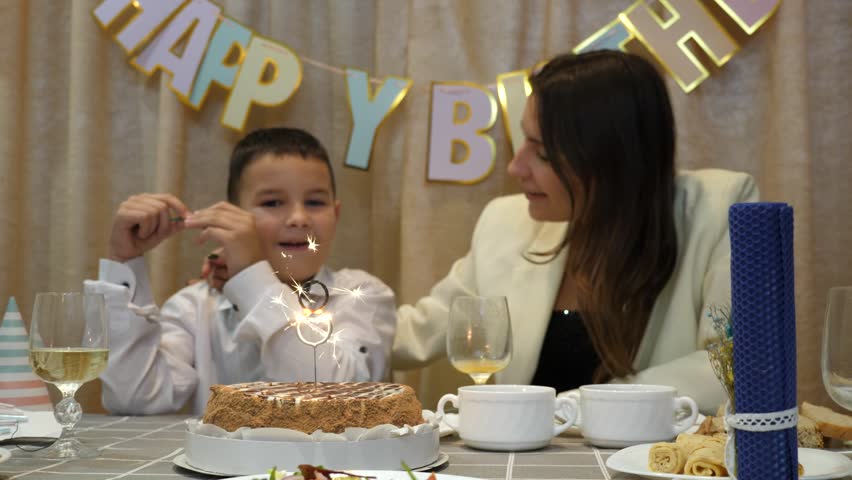 A cake with a figure of eight and candles is served to the table. Birthday celebration.