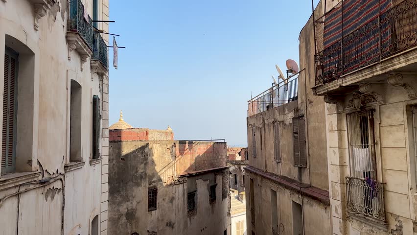 Old damaged French colonial buildings exterior in Alger Casbah Algiers old town Algeria North Africa