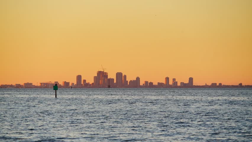 St Petersburg, Florida USA - Nov 02, 2024: St Petersburg Downtown city skyline and skyscraper seen from Apollo Beach Eg Simmons regional park landscape