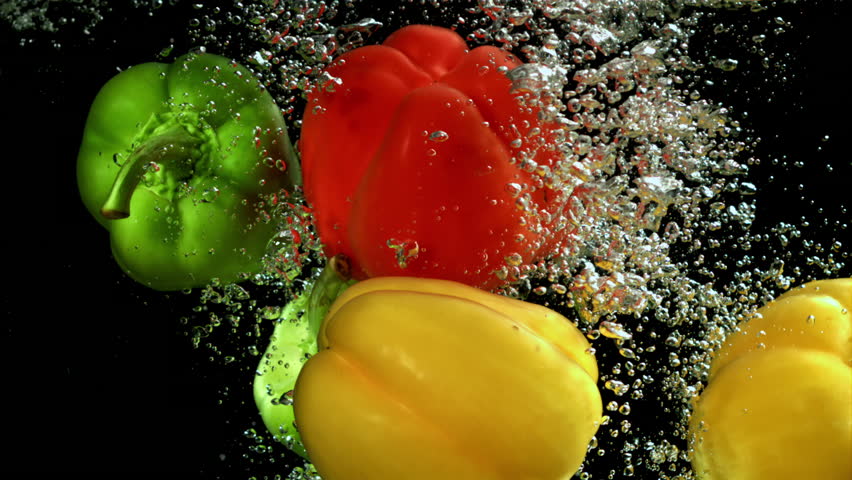 Fresh bell peppers falling into water on slow motion - Powered by Shutterstock - Get 15% off with code: PIKWIZARD15