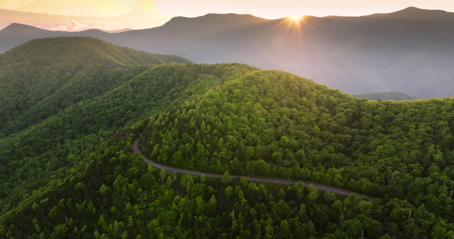 Mountain pass road in North Carolina Appalachian mountains, USA. Blue Ridge Parkway in summer season at sunset