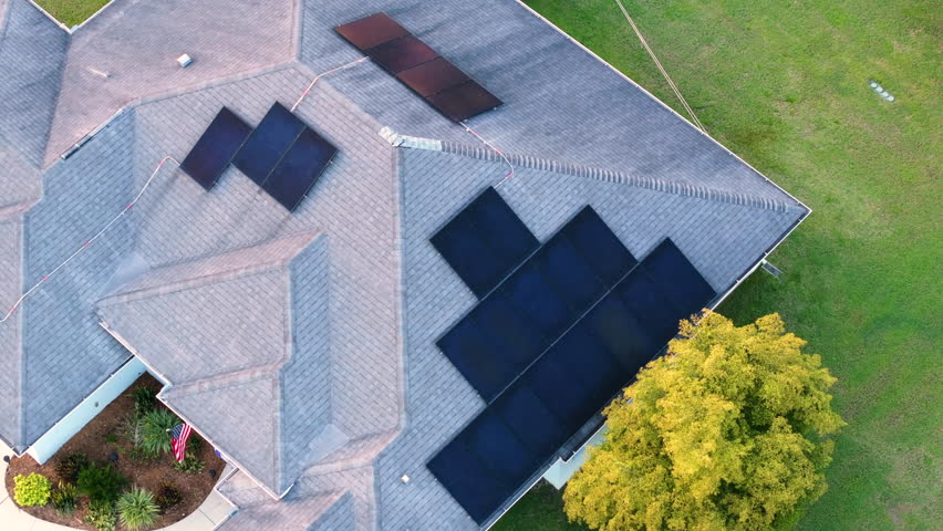 Photovoltaic solar panels on Florida home roof for producing clean ecological electric energy. Renewable electricity with zero emission concept