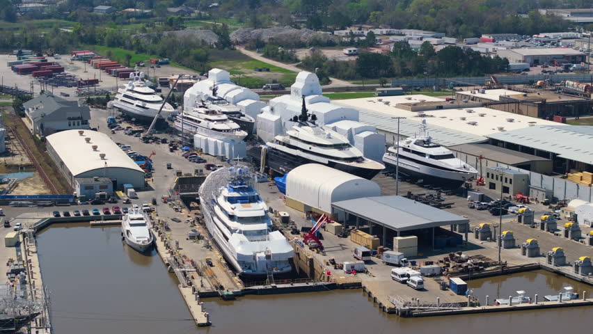 Production shipyard with deep sea luxury yachts under construction. Assembly and service of sea vessels in Savannah, Georgia, USA.