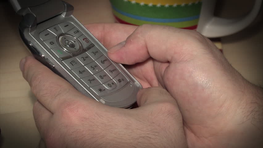 Texting on a cell phone.