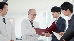 A doctor and a salesman talking - Powered by Shutterstock - Get 15% off with code: PIKWIZARD15