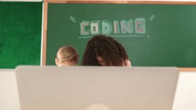 Smart girl standing while fixing electronic board by using screwdriver. Happy student and happy caucasian boy working together to inspect electric system. Curious children working on board. Pedagogy. - Powered by Shutterstock - Get 15% off with code: PIKWIZARD15