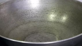 Adding cooking oil in a wok.  - Powered by Shutterstock - Get 15% off with code: PIKWIZARD15