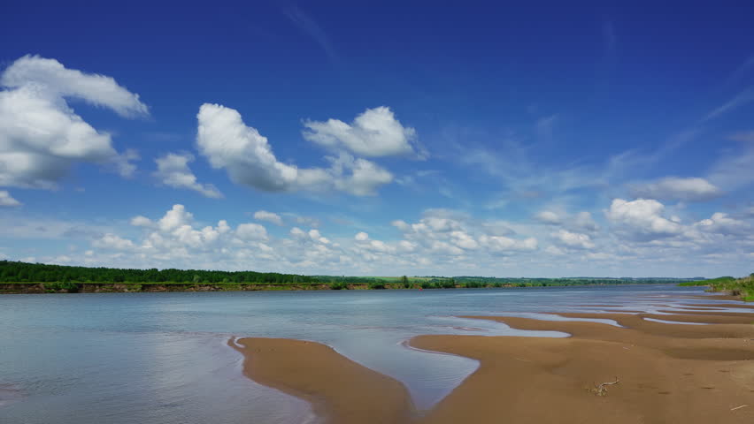 Clouds in sky over river landscape, time lapse, 4k