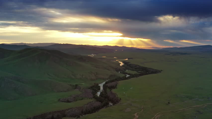 Aerial view of steppe and mountains landscape in Orkhon valley at dawn, Mongolia, 4k
